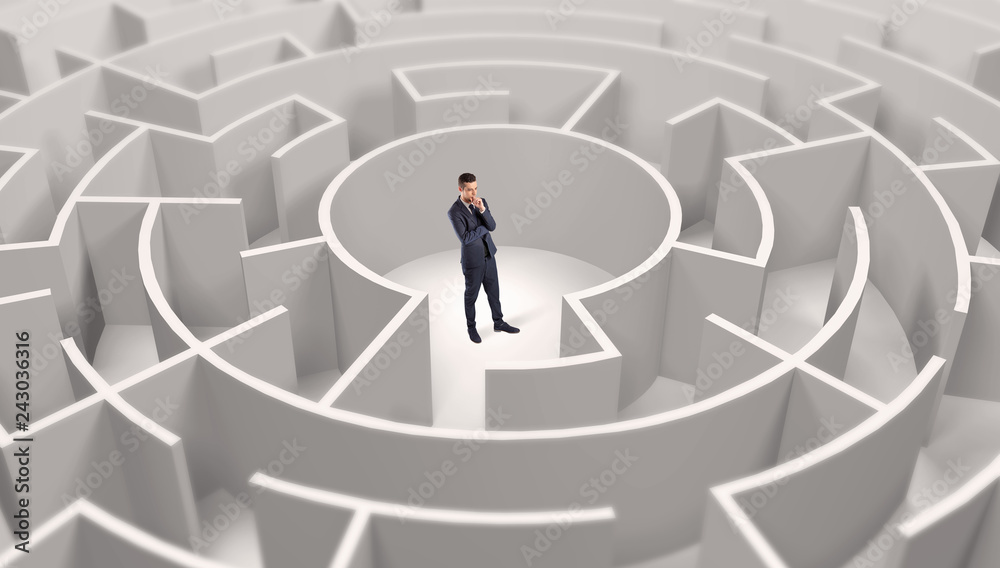 Young businessman standing in a middle of a 3d round maze
Young businessman standing in a middle of a 3d round maze