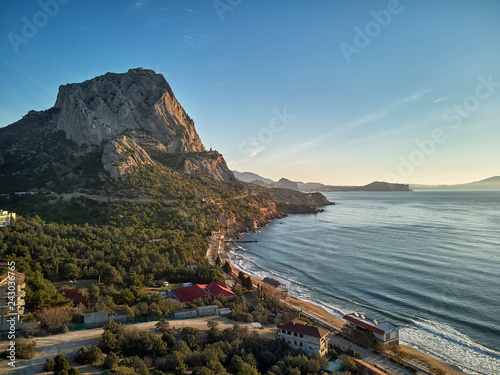 Fototapeta Naklejka Na Ścianę i Meble -  Sunset near the village Novyi Svit New light . City district Sudak, the Republic of Crimea. Aerial view