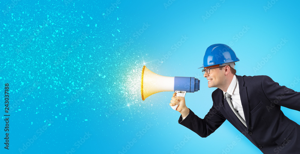 Fototapeta premium Young architect constructor yelling with megaphone and sparkling sounds 