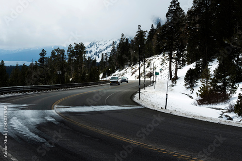Van And Pickup On Mountain Road With Snow