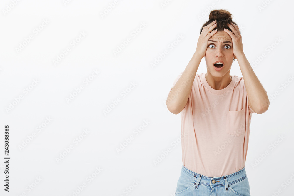 Woman got robbed being freak out and panicking realising she lost  everything holding hands on head in shocked pose standing with opened mouth  and popped eyes as frowning, overthinking Photos | Adobe