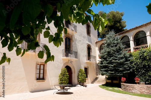 traditional historic catalan house called masia in spanish countryside, perfect location for summer holidays photo