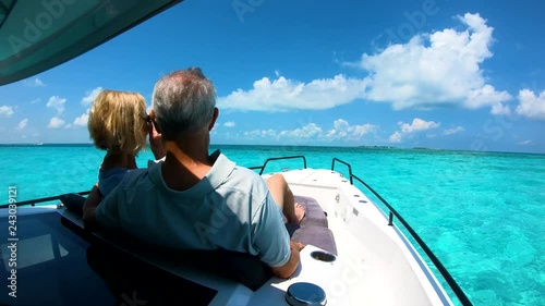 Active senior travellers sailing on luxury yacht Bahamas photo