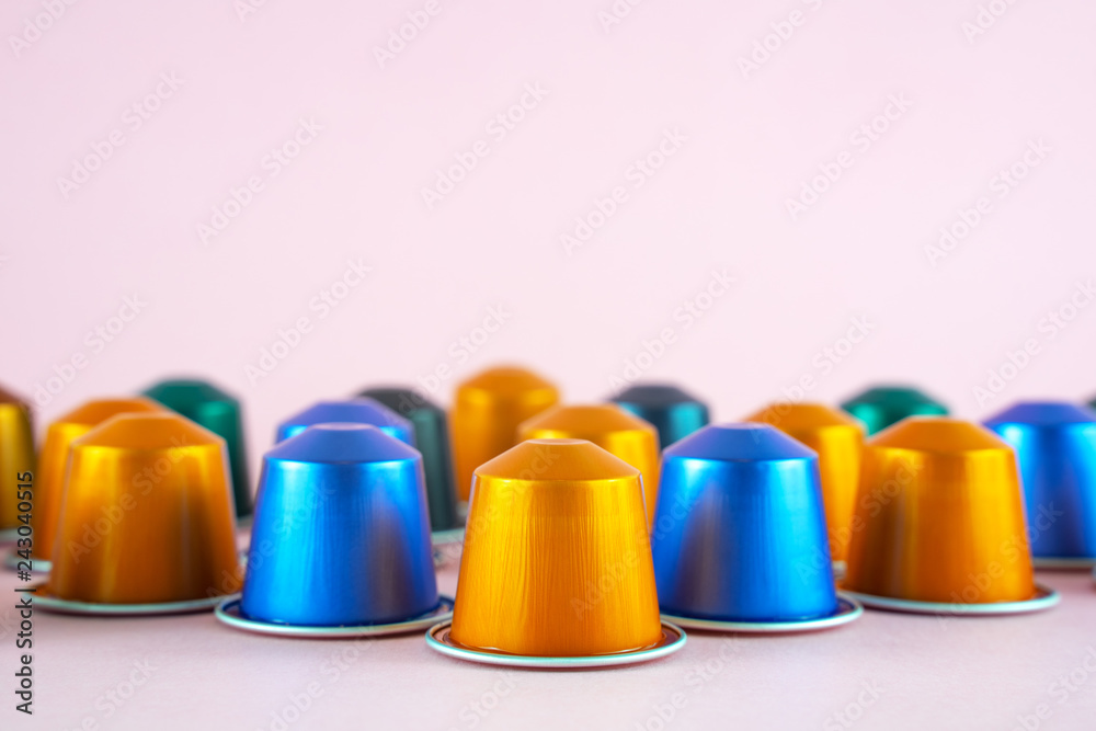 Colorful collection of espresso coffee machine capsules on pink background. Colorful collection of espresso coffee machine capsules on pink background.