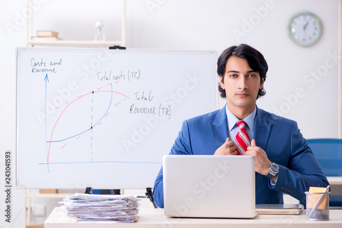 Busy businessman explaining business charts