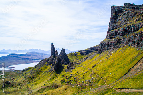 Travel Europe, Scotland, Highlands, Isle of Skye (Tourist popular destination). Scenic mountain landscape view of The Old Man Of Storr attraction, sharp rocks and lakes on background in summer time.