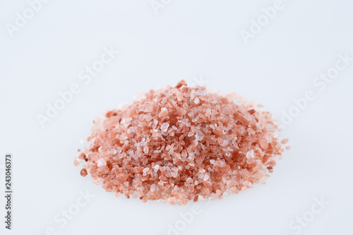 Pink himalayan salt isolated on white background.
