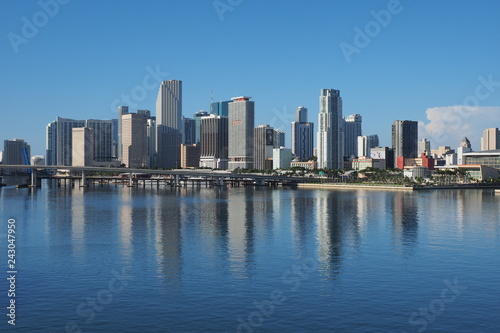 Miami  Florida 09-15-2018 The City of Miami skyline and its reflection on a very calm Biscayne Bay in morning light.