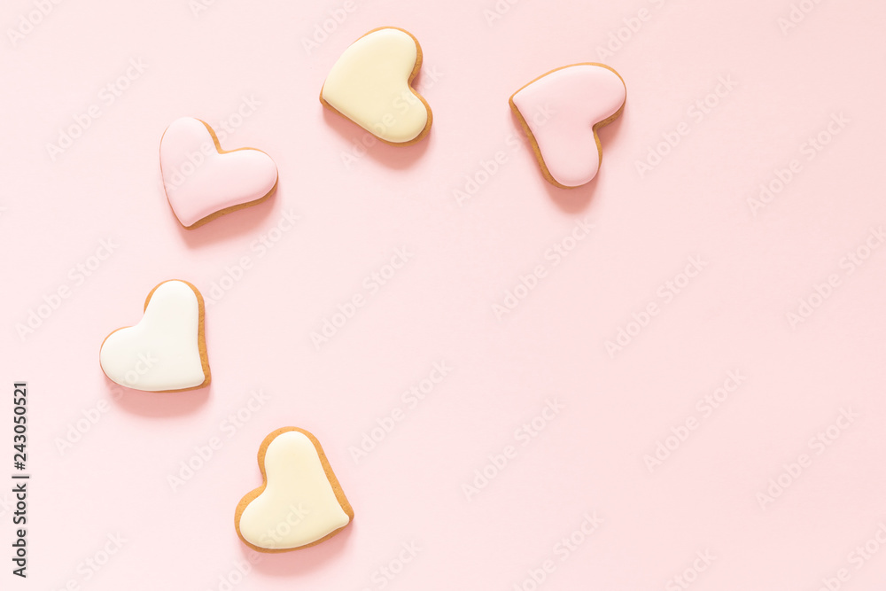 Fototapeta premium Composition Valentine's Day. Ginger cookie in shape heart on pastel pink background. Valentine day concept, design.