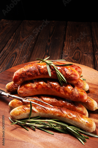 Grilled sausages with spices on a wooden table - Home-made Pork Sausages
