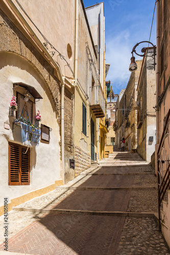 Colorful uphill street in Sciacca historic centre, Sicily, Italy