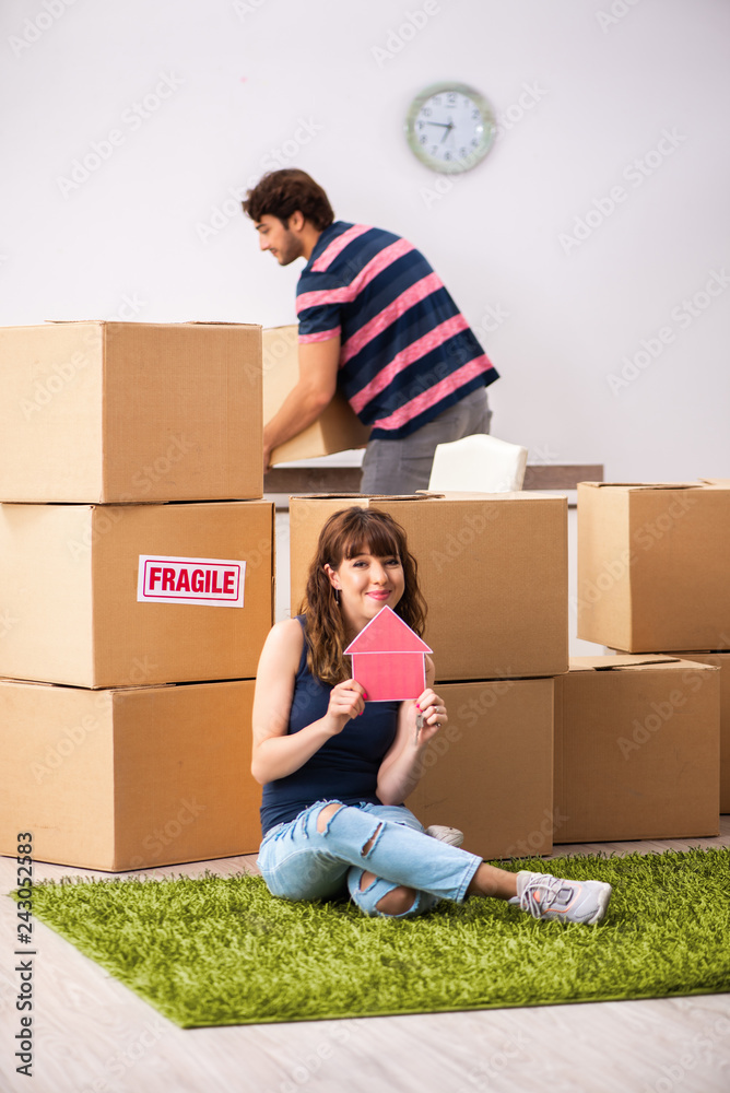 Young family moving to new house apartment Young family moving to new house apartment