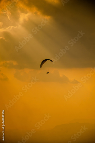 Paragliding in the sky,Paraglider taking off in front of spectacular mountain scenery