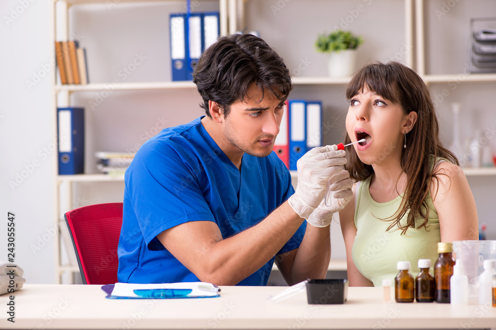 Doctor getting saliva test sample in clinic hospital Doctor getting saliva test sample in clinic hospital