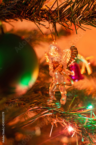 Tree and Christmas decorations. Decorated Christmas tree on blurred, sparkling and fairy background. Selective focus