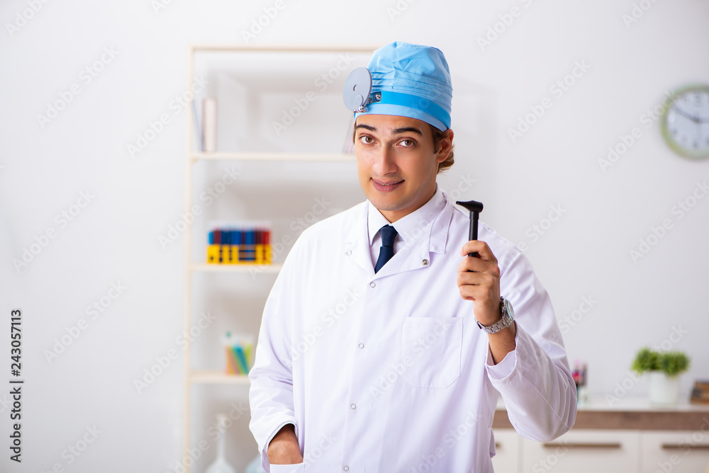 Young male doctor otolaryngologist working at the hospital Young male doctor otolaryngologist working at the hospital