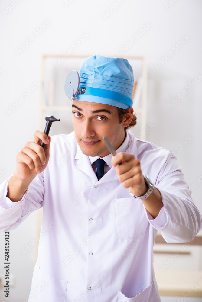 Young male doctor otolaryngologist working at the hospital Young male doctor otolaryngologist working at the hospital