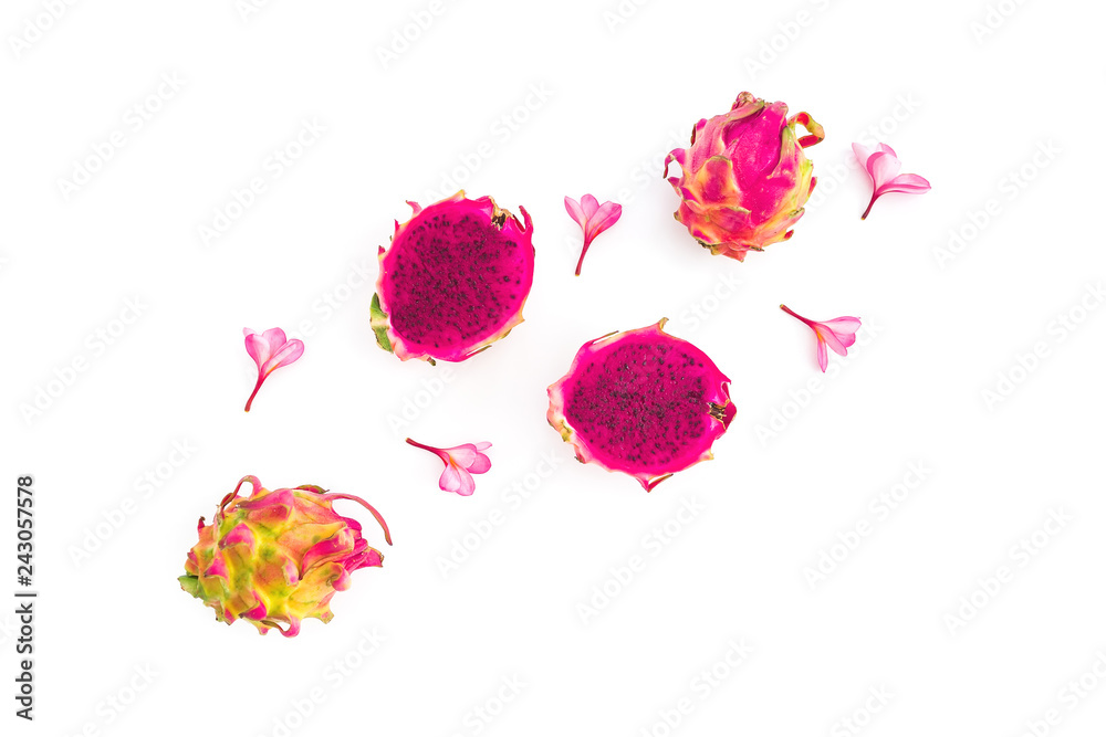 Fruit composition with dragon fruits and tropical flowers on white background. Flat lay, top view.