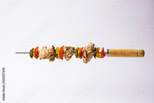 Chicken Hariyali kakab or Malai malai kebab served with skewers and yogurt dip in a plate. selective focus photo