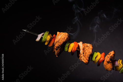 Chicken Hariyali kakab or Malai malai kebab served with skewers and yogurt dip in a plate. selective focus photo