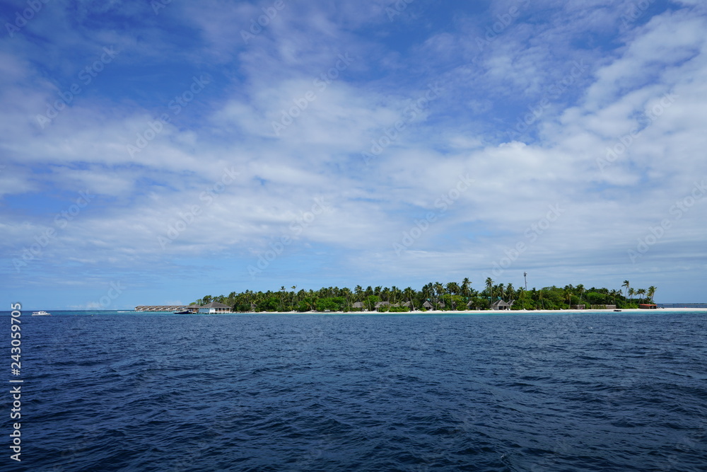 View of an island in the Maldives from a boat