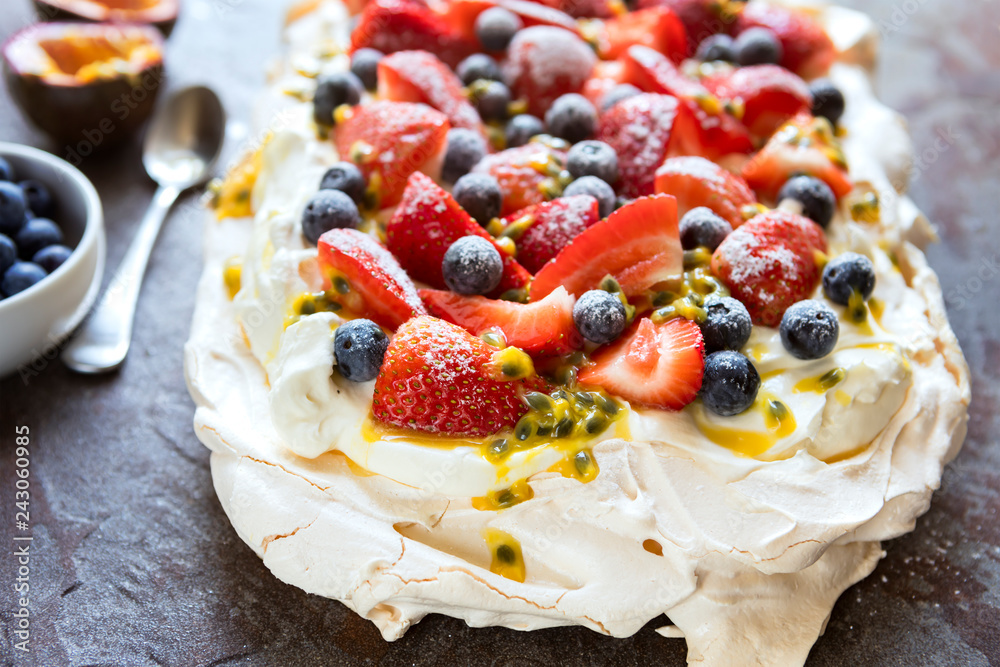 Pavlova Meringue Cake with Berries and Passionfruit Top View Pavlova Meringue Cake with Berries and Passionfruit Top View