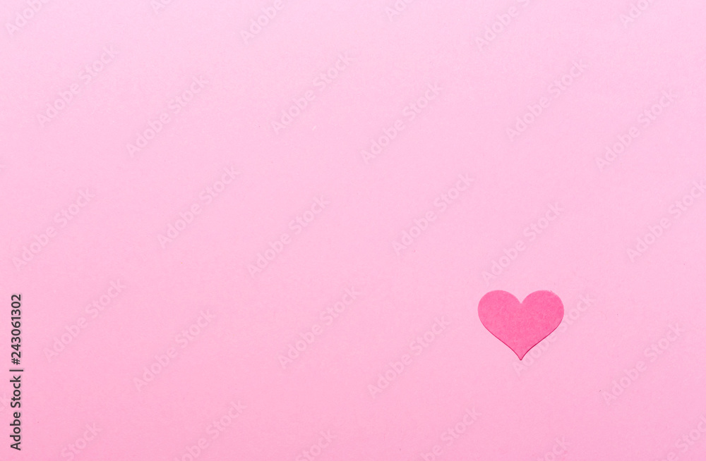 Pink heart on a pink paper background