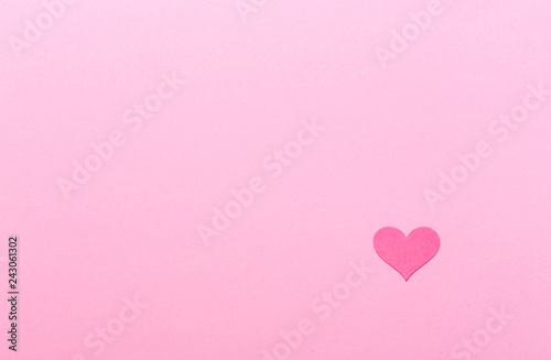 Pink heart on a pink paper background