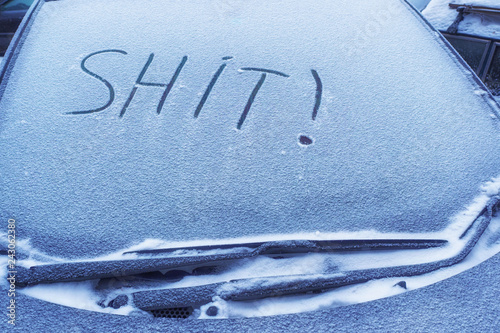 frozen glass of a car on a winter day