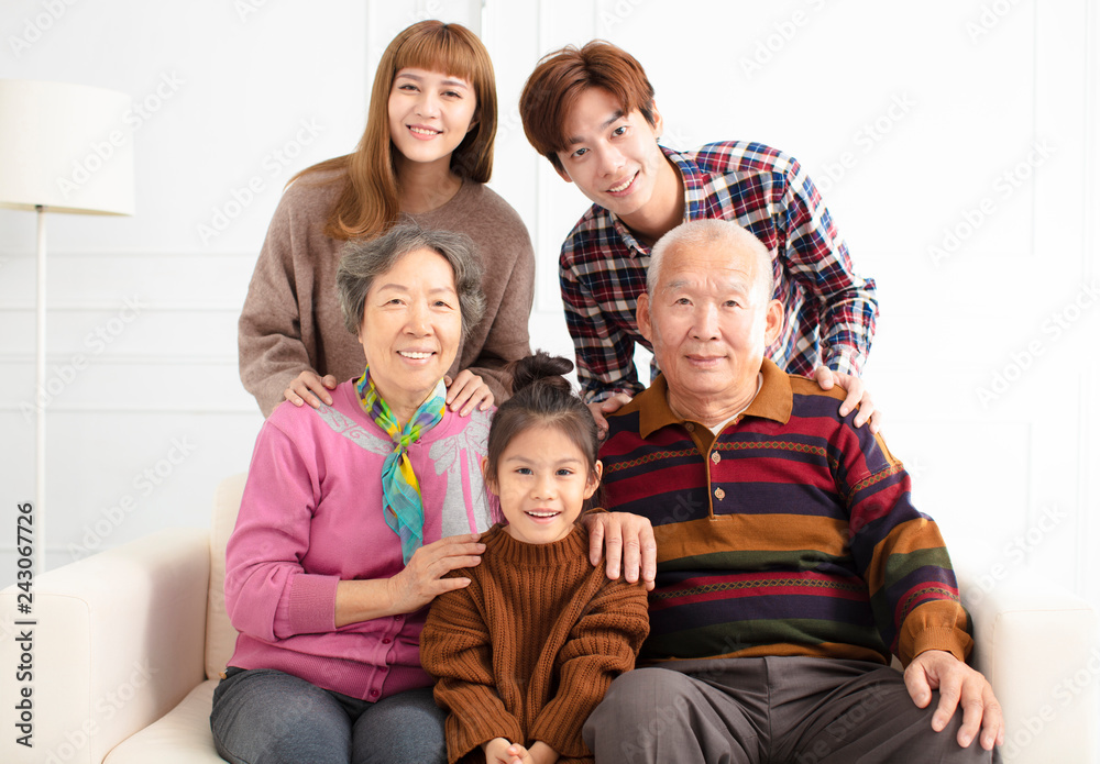 happy three generations asian family on sofa happy three generations asian family on sofa
