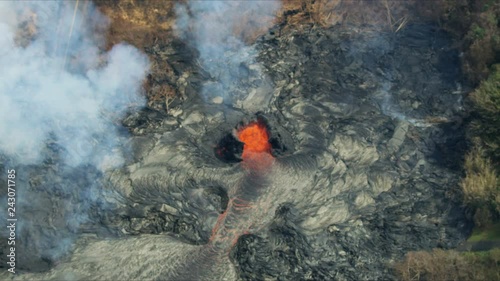 Aerial view of active volcanic activity destroying trees
