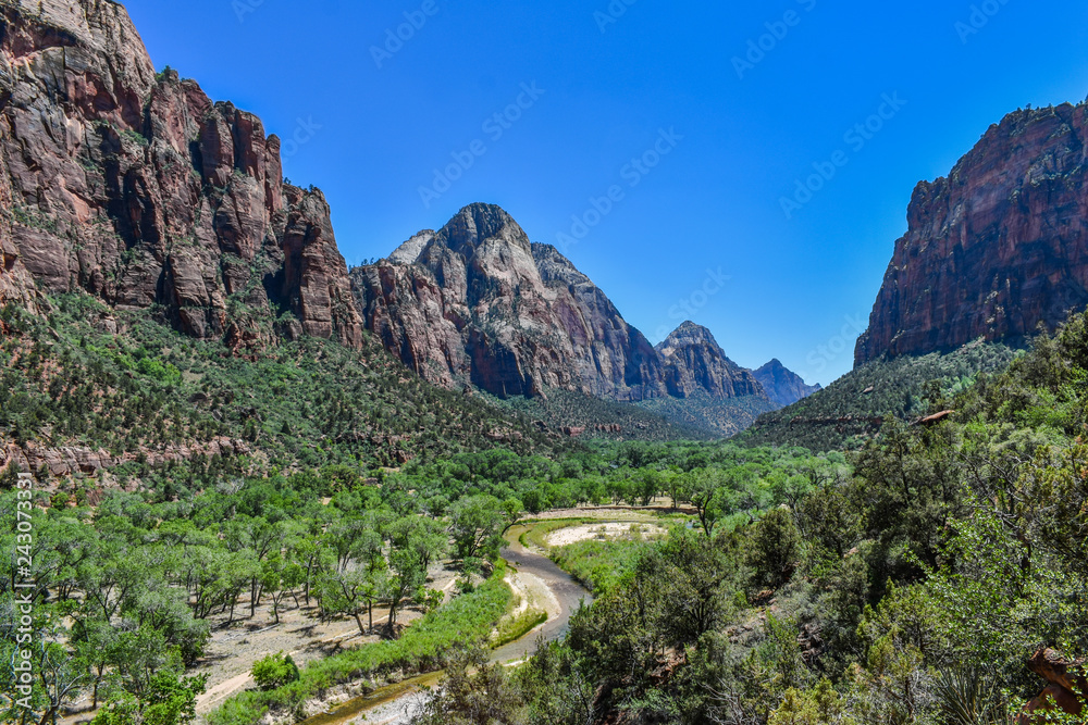 A shallow river going through the mountains in Zion National Park, USA A shallow river going through the mountains in Zion National Park, USA