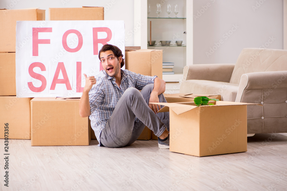 Young man offering home for sale and moving out Young man offering home for sale and moving out