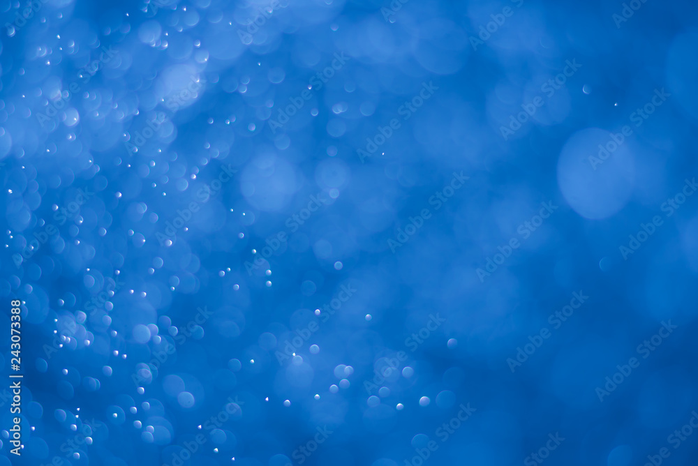 abstract deep blue background with blur bokeh light effect