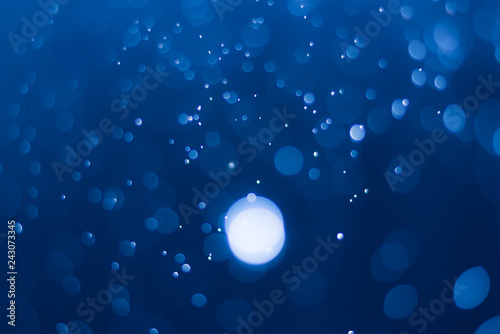 Fototapeta Naklejka Na Ścianę i Meble -  abstract deep blue background with blur bokeh light effect