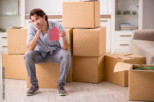 Young man offering home for sale and moving out 