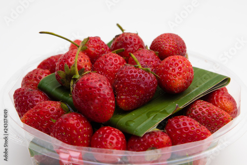 Fresh Red Strawberries on white plate on white background