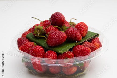 Fresh Red Strawberries on white plate on white background