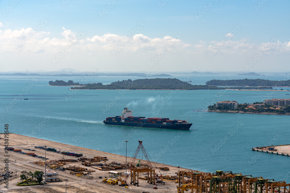 Container ship about to enter the container terminal