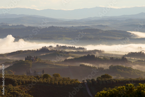 Previously foggy autumn morning in Tuscany. Surroundings of San Gimignano, Italy