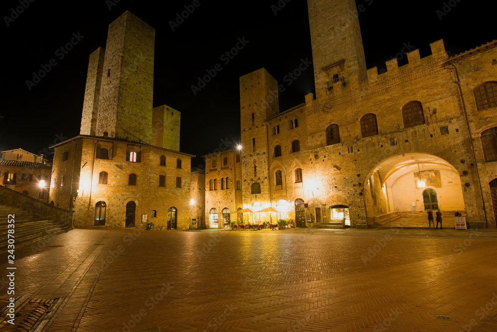 Night on the central square of medieval San Gimignano. Tuscany, Italy