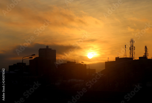 Bright photo background sunset in the city in the evening