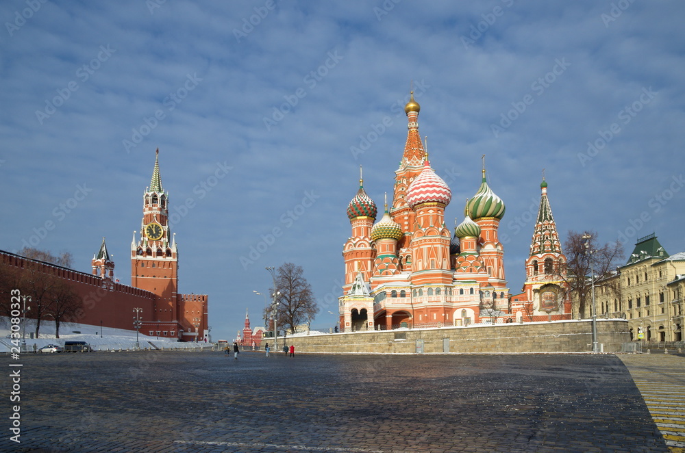 Winter view of the Cathedral of the Intercession of the Holy virgin, the Moat (St. Basil's Cathedral) and the Spasskaya tower of the Moscow Kremlin. Moscow, Russia