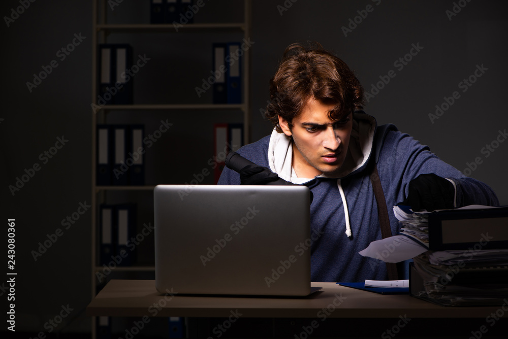 Thief trying to steal personal data in identity theft concept Thief trying to steal personal data in identity theft concept
