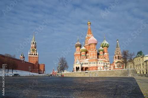 Winter view of the Cathedral of the Intercession of the Holy virgin, the Moat (St. Basil's Cathedral) and the Spasskaya tower of the Moscow Kremlin. Moscow, Russia