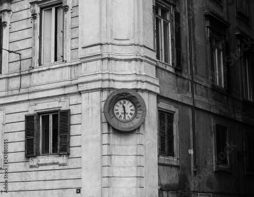 clock on facade of an old building