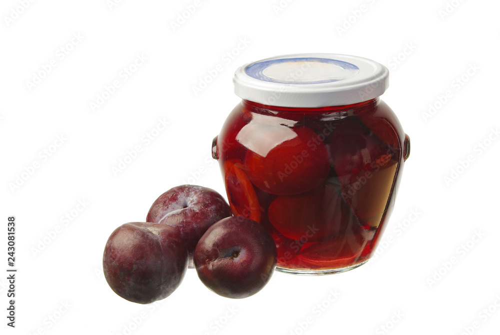 Fresh plums and plum compote in a glass jar. Fresh plums and plum compote in a glass jar.