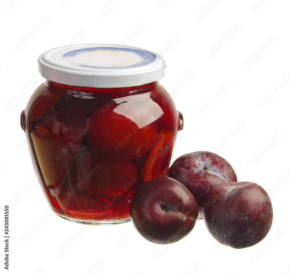 Fresh plums and plum compote in a glass jar. Fresh plums and plum compote in a glass jar.