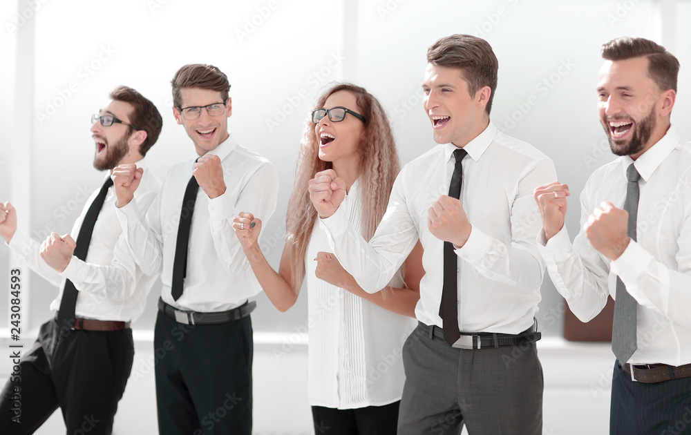 happy business team celebrating their success happy business team celebrating their success