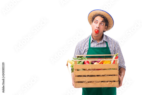 Young farmer with fresh produce isolated on white background